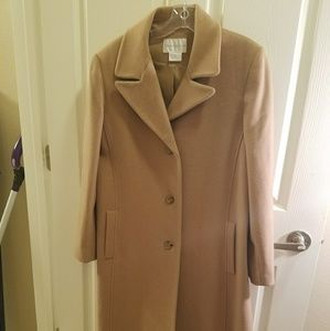 Lady's long brown peacoat.